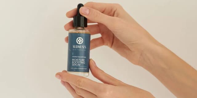 Moisturizing serum in woman's hands