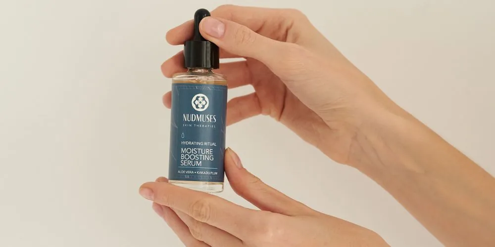 Moisturizing serum in woman's hands